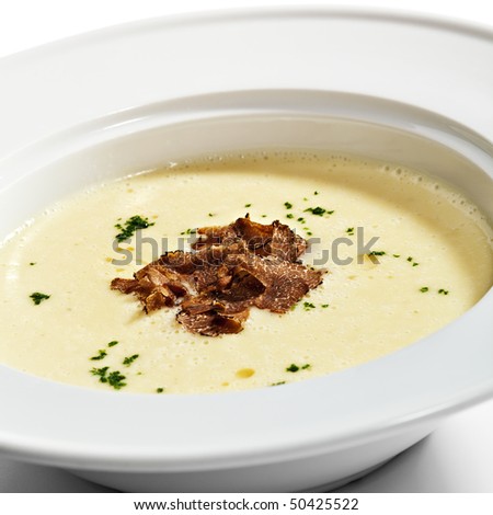 Potato Cream Soup garnished with Greens and Tartufo Bianco (white truffle)