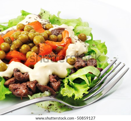 Chicken Salad Composed Chicken Liver and Pepper Dressed with Salad Leaves and Green Peas. Isolated on White Background