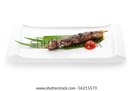 Grilled Chicken Heart  Garnished with Cherry Tomato and Green Leaf