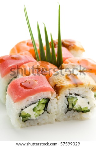 Rainbow Maki Sushi - Roll with Cucumber and Cream Cheese inside. Tuna, Salmon and Eel outside