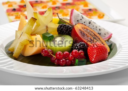 Exotic Fruit Dish with Mint Jelly. Dragon Fruit, Maracuya, Starfruit, Cantaloupe and Berries