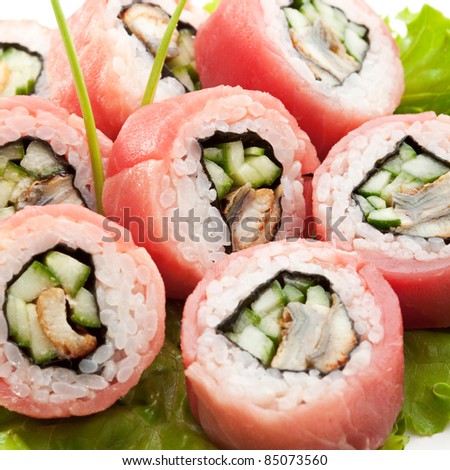Tuna Maki Sushi - Roll made of Smoked Eel and Cucumber inside. Fresh Raw Tuna outside