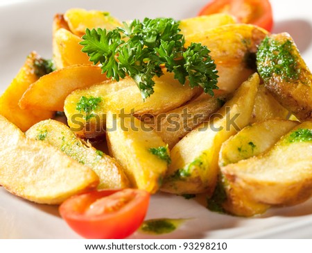 Deep Fried Potato Slice Garnished with Cherry Tomato and Parsley