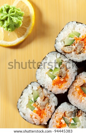 Japanese Cuisine - Sushi Roll with Eel, Cucumber and Masago (fish roe) inside. Nori outside