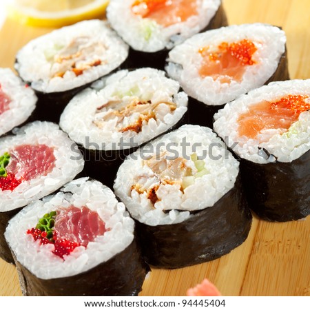 Maki Sushi - Roll made of Tuna, Salmon, Eel, Cream Cheese, Fruits and Vegetables inside. Nori outside