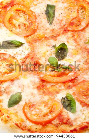 Pizza Caprese made with Mozzarella, Tomatoes, Oregano and Basil
