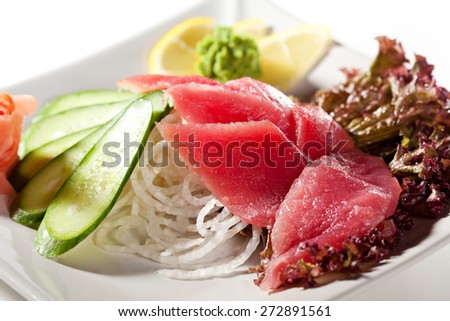 Tuna Sashimi - Sliced Raw Tuna on Daikon with Seaweed and Cucumber