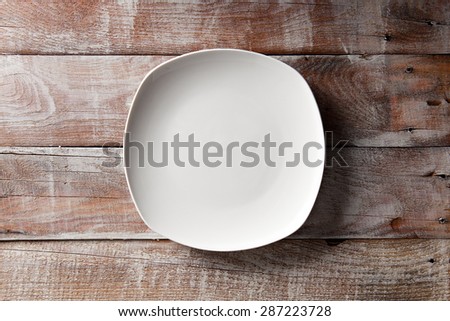 Empty White Plate on Wooden Table