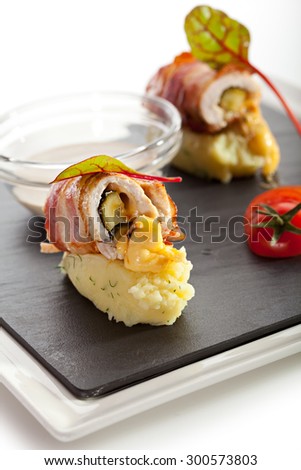 Bacon Wrapped Chicken Breast on Mashed Potato with Mushrooms Sauce