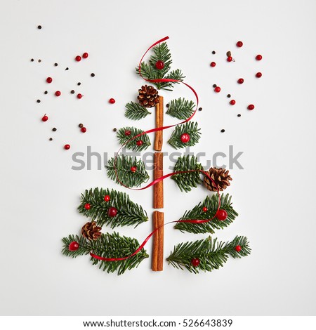 Christmas Tree made of Winter Foliage and Cinnamon Sticks. Holiday Concept. Flat Lay