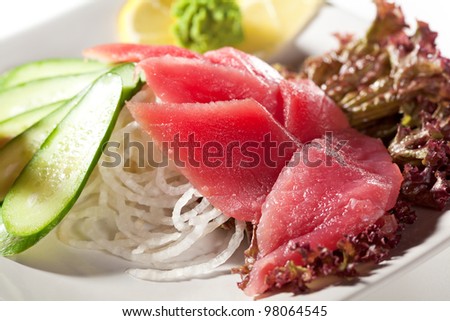 Tuna Sashimi - Sliced Raw Tuna on Daikon (White Radish) with Seaweed and Cucumber