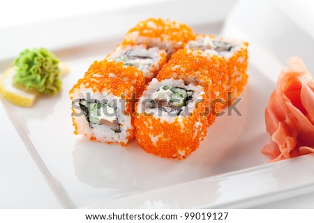 Maki Sushi with Fresh Salmon, Cucumber and Cream Cheese inside. Tobiko outside