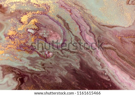 Marble abstract acrylic background. Marbling artwork texture. Agate ripple pattern. Gold powder.