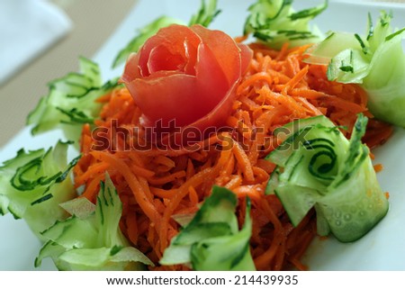 Salad of the Korean carrot is decorated by flower made from vegetables