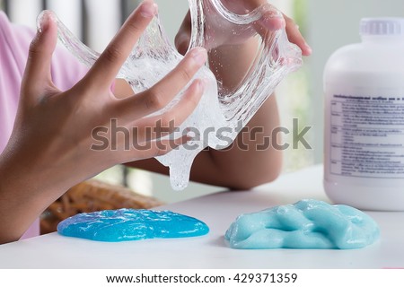 Kid Playing Hand Made Toy Called Slime