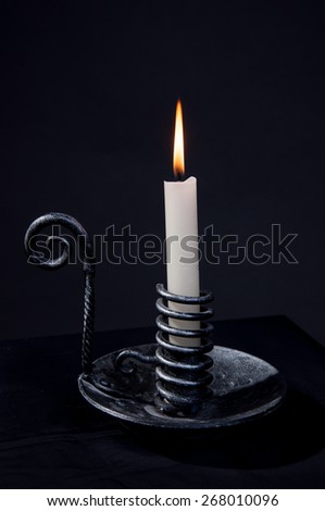 Candle in metal candle-holder