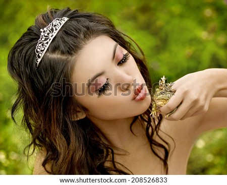 Beautiful princess about to kiss her frog prince