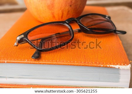 Glasses on the books at work