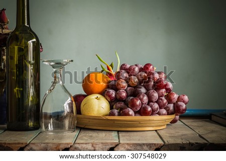 Fruit tray and a glass of wine with vintage