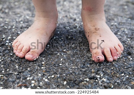 Little girls feet in sand