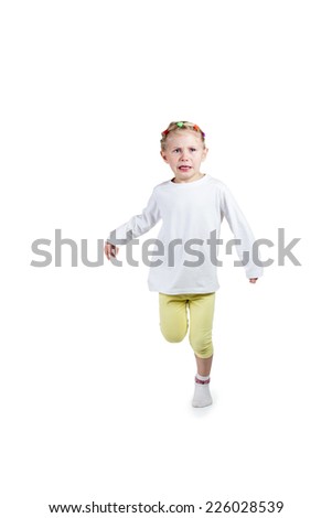 Portrait of a little girl in a white blouse running is crying isolated on white background