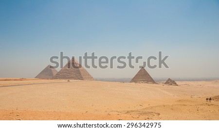 Pyramids of Giza, Cairo, Egypt with camels in the foreground