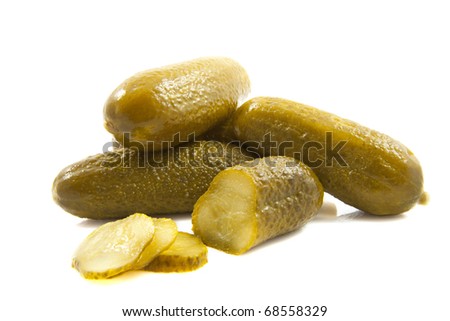 Fresh sliced green pickles isolated over white
