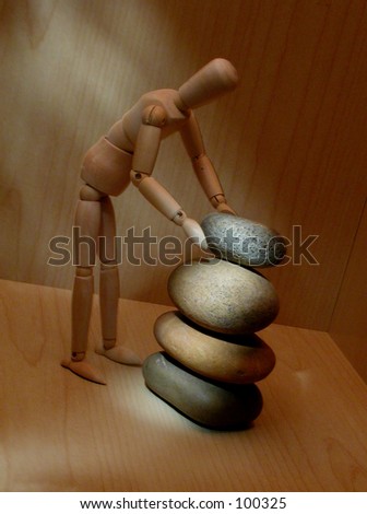 Mannequin 2 ( series)  Mannequin stacking stones. Building, flow, focus, and stability metaphor.
