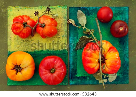 Heirloom tomatoes on painted surfaces. Clockwise from lower left: Red Brandy Wine and Yellow Brandy Wine, Caver (?), Black Prince, and a Striped German/Hess.