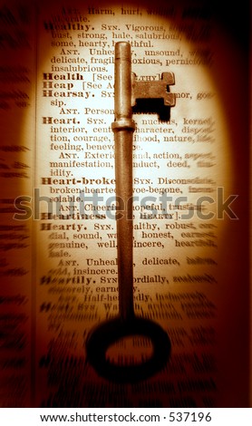 Old key on 100 year old thesaurus with Health synonyms. Old Fashioned Health Key.
