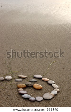 Spiral of stones broken by the receding surf.  The rhythmic pulse of the universe is both change and changelessness.  To let go is to create in the wave.