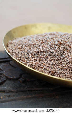 Still life photograph of Psyllium seeds. A natural herbal remedy for constipation, weight loss, and inflammation.