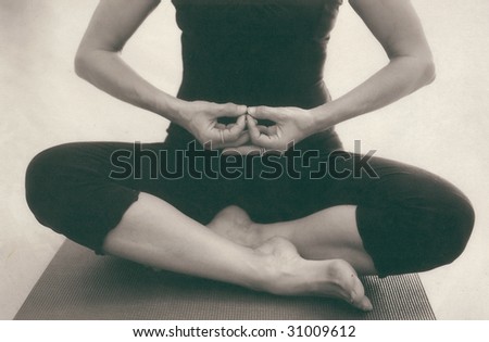 The hands and body of a woman in meditation. Scan of alternative fine art photo print on Kozo paper.
