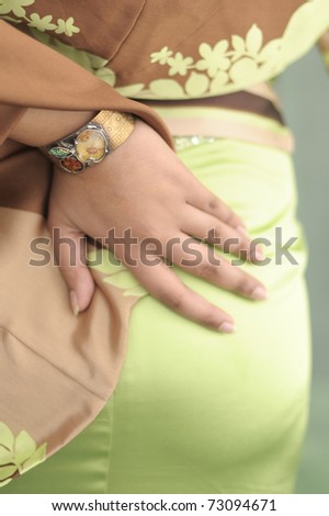 Sensual style. A lovely bracelet revealed on the back side of a woman