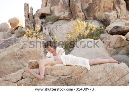 Body worker and client in a stone environment.