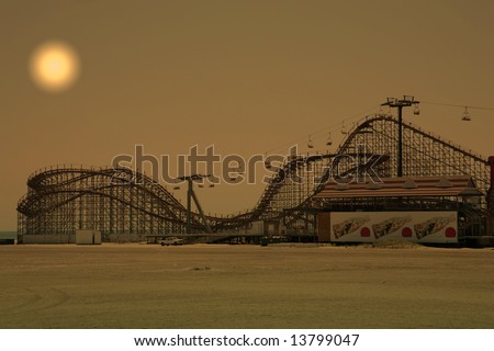 wooden roller coaster on beach during sunset hours