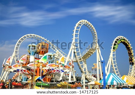 Amusement park rides with a very blue sky as background