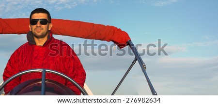 captain on a rubber boat, man driving an inflatable motor boat