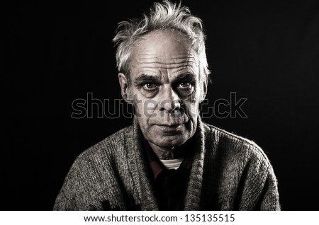 Old man on black background