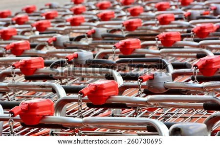 Shopping carts locked outside near entrance of supermarket