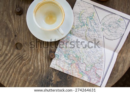 Empty coffee cup and the old map, Europe and travel - top view