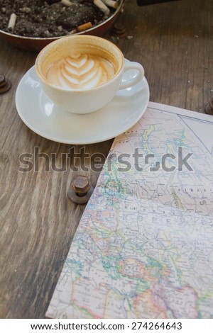 Coffee cup and the old map, Europe and travel.