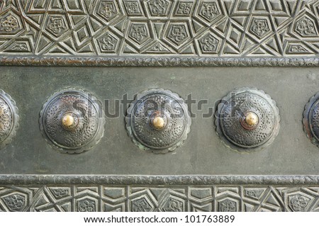 Detail from one of the bronze doors of the 395 year old Blue Mosque in Istanbul, Turkey