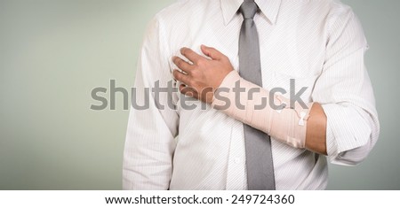 businessman with his broken left arm