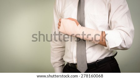 businessman with his broken left arm
