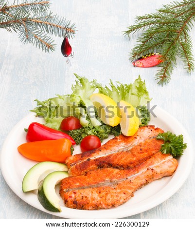 Christmas dinner for fish men - fir decorated with wobbler