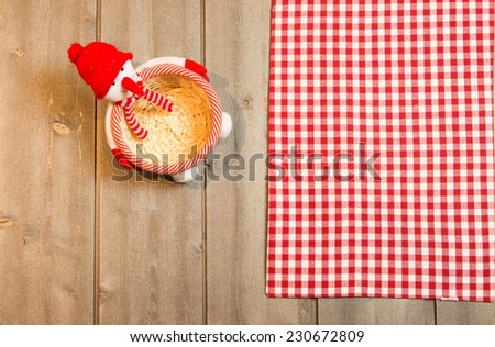 Tablecloth white red squares  on wooden background with christmas decorations