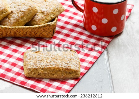 square shape bread on basket  wooden background with red mug