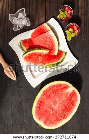 Cooking of watermelon drink, top view, wooden background