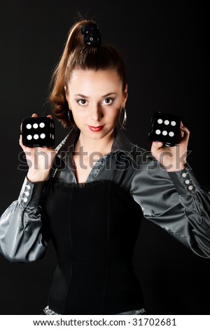 Young girl shows two dice with six roll of the dice